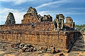 Angkor - Eastern Mebon - monolithic elephants at the corners of the platforms of the pyramid